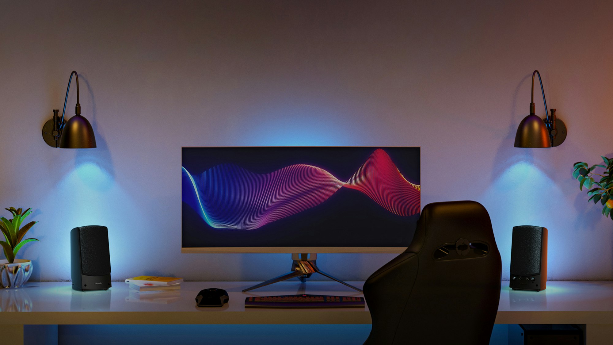 ProMedia 2.0 on a computer desk under wall sconce lights